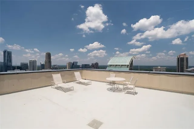 a view of a swimming pool and a city