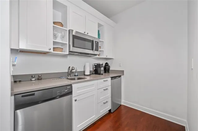 a bedroom with a bed and a lamp