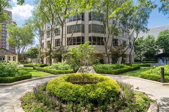 a view of a house with a yard and plants