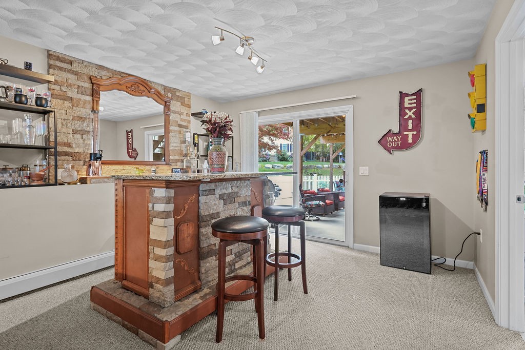 3 Valley Drive Johnston, RI 02919 - Photo 30 of 36 lower level, dry bar with fridge and walk out to patio