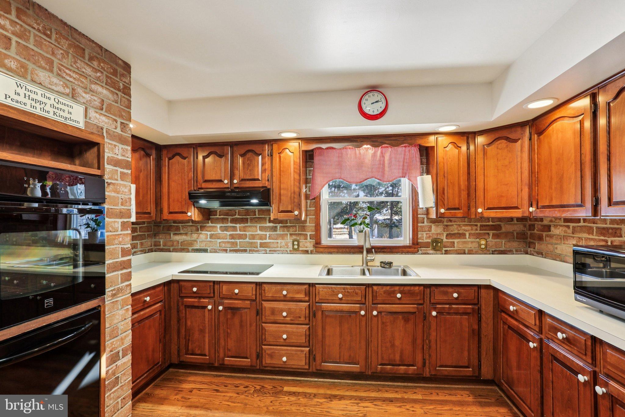 412 Marsteller Road New Park, PA 17352 - Photo 15 of 47 Warm, inviting kitchen with rich wood tones.