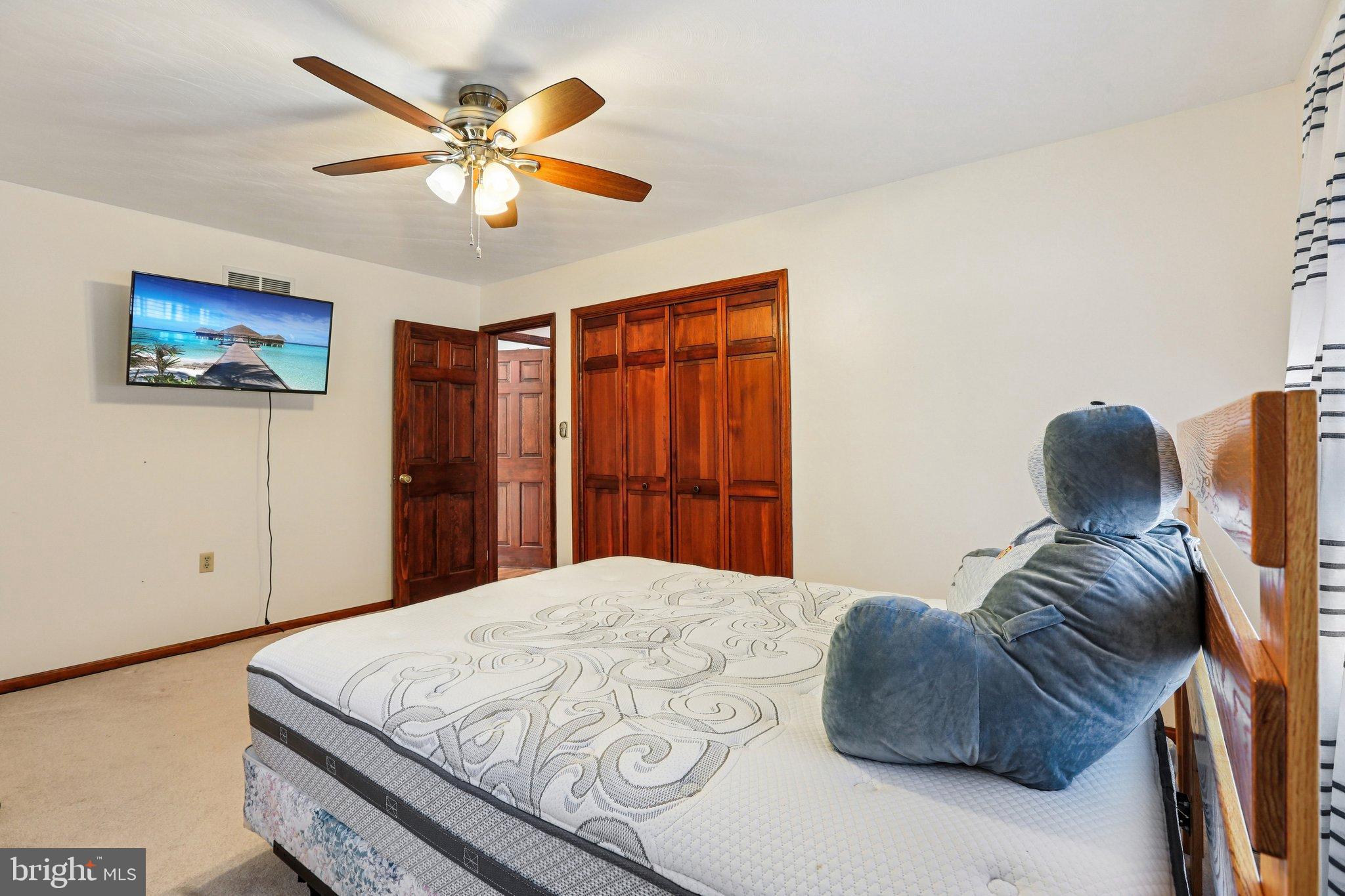 412 Marsteller Road New Park, PA 17352 - Photo 30 of 47 Cozy bedroom with warm wooden accents.