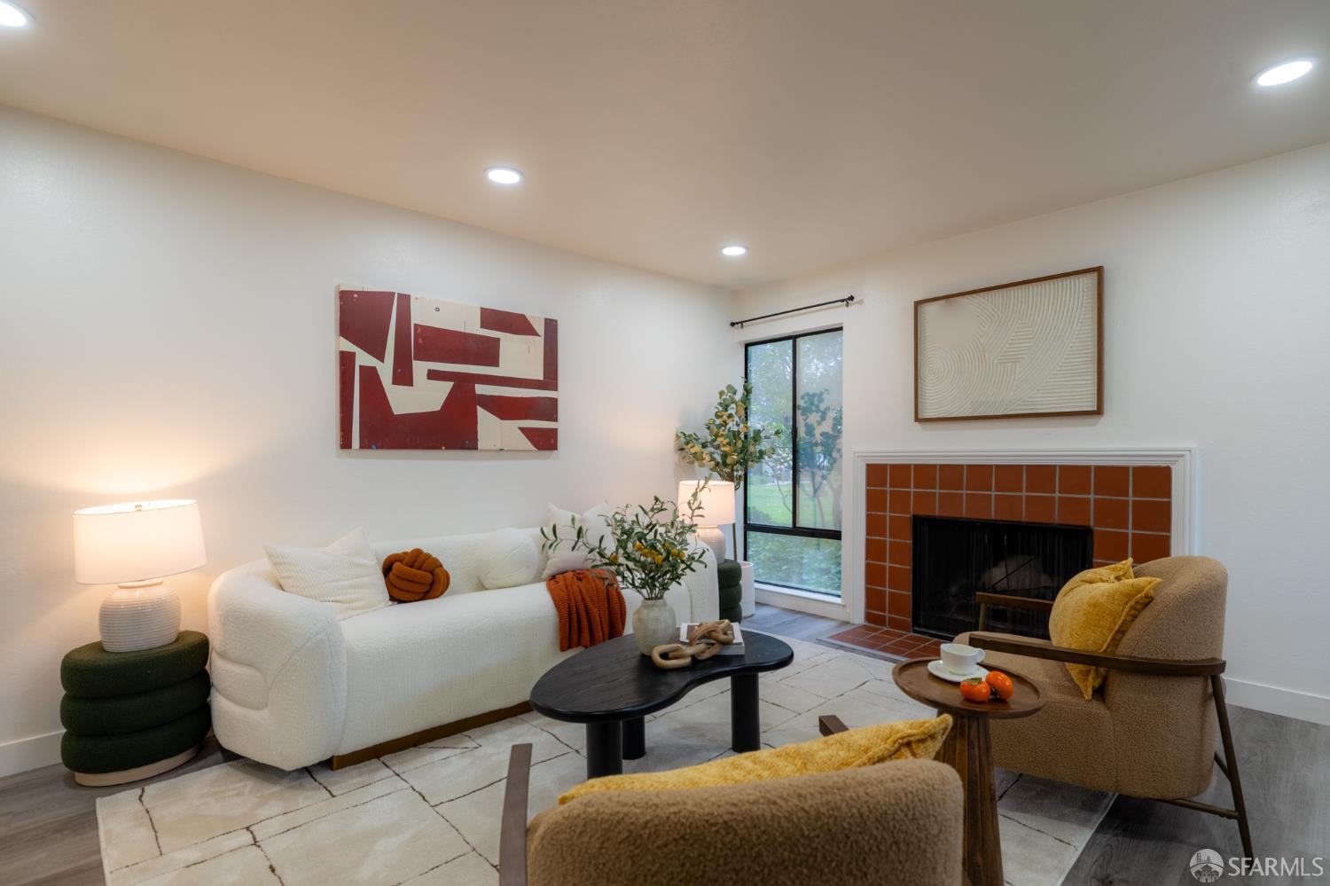 a living room with furniture and a fireplace