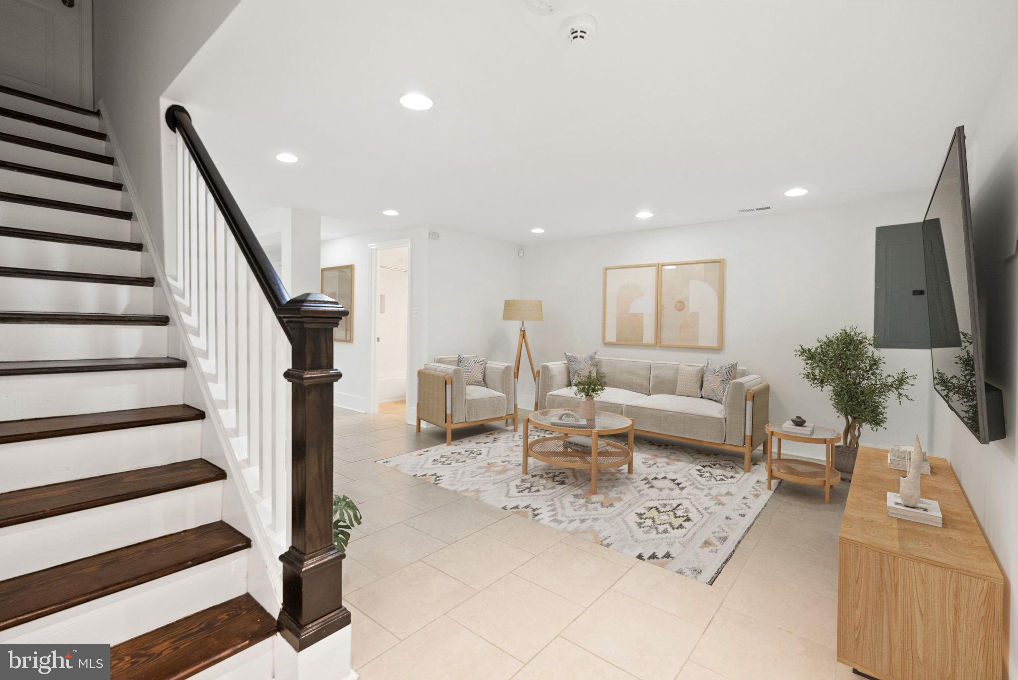 113 Hamilton Street Northwest Washington, DC 20011 - Photo 18 of 24 a living room with furniture and a flat screen tv