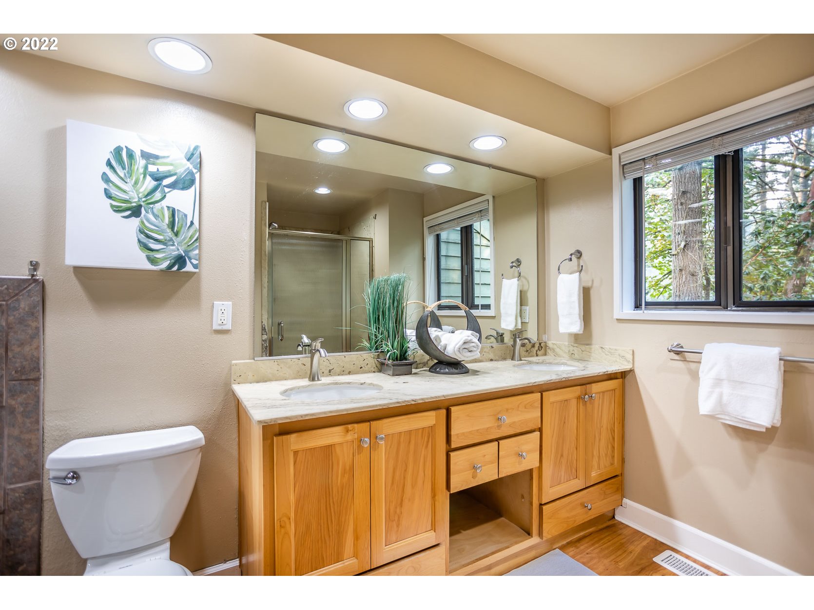 2017 Kimberly Drive Eugene, OR 97405 - Photo 12 of 32 a bathroom with a sink a toilet and a window
