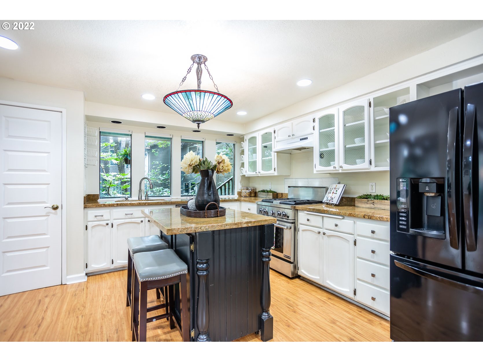 2017 Kimberly Drive Eugene, OR 97405 - Photo 6 of 32 a kitchen with stainless steel appliances granite countertop a stove refrigerator and cabinets
