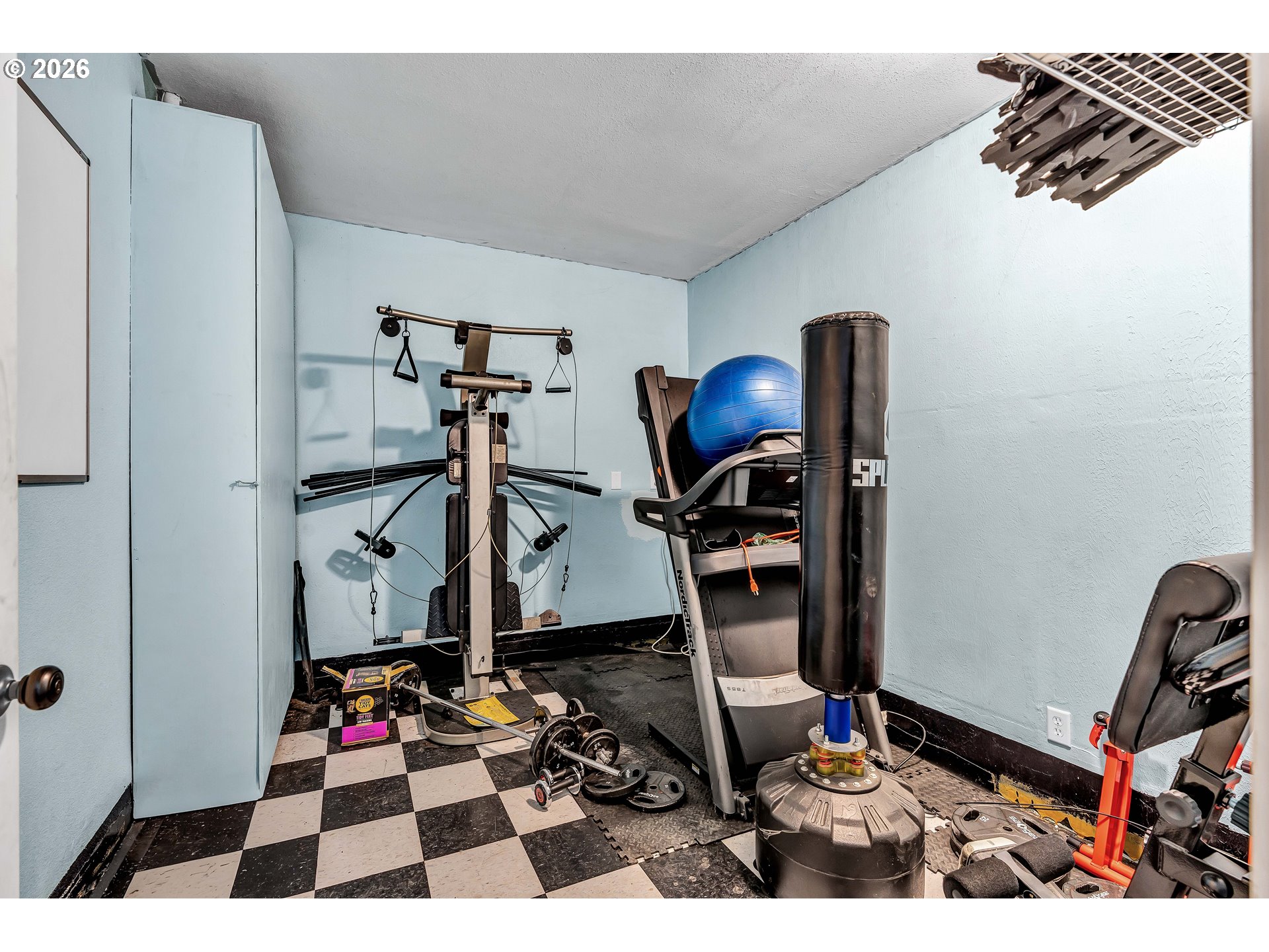 12313 South Groshong Road Molalla, OR 97038 - Photo 37 of 48 a room with gym equipment and wooden floor