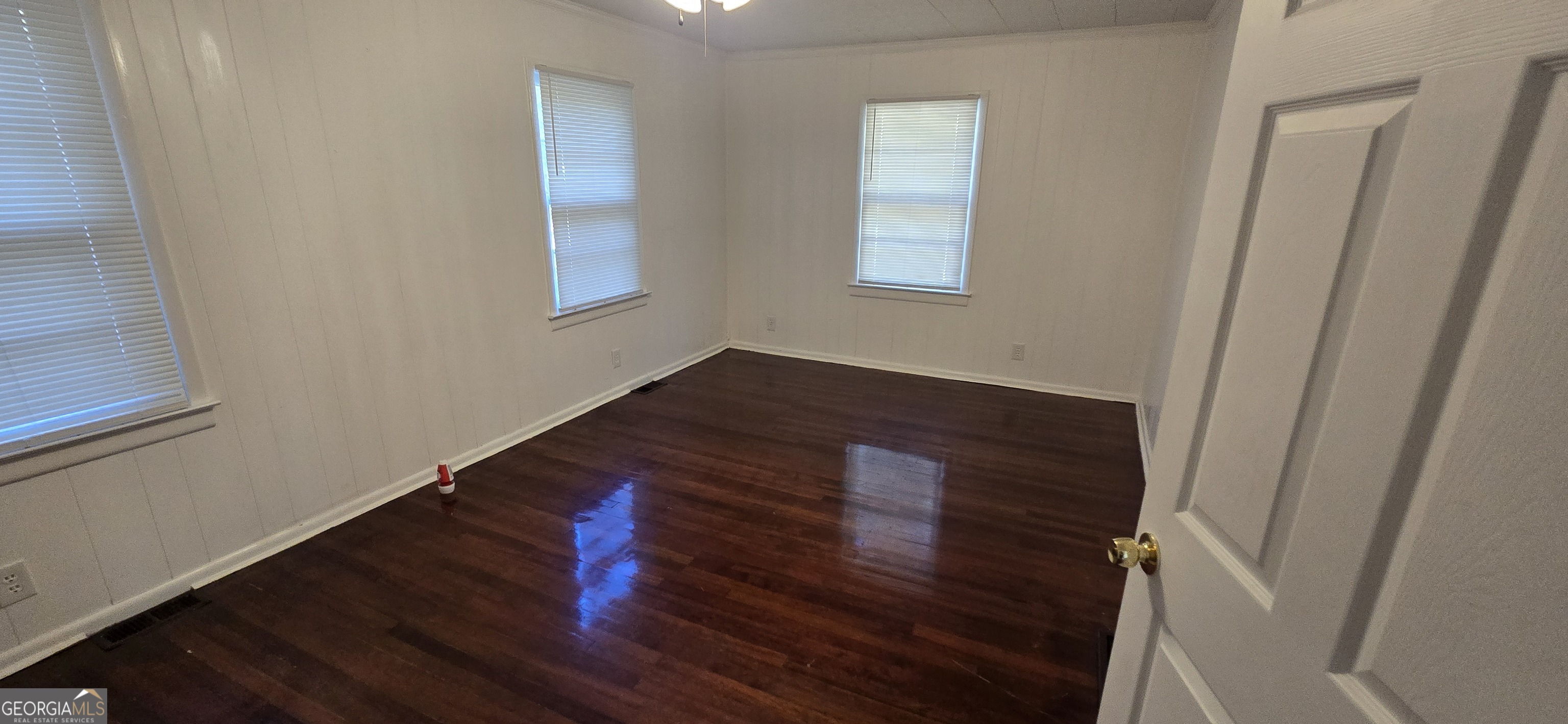 4085 Canby Lane Decatur, GA 30035 - Photo 3 of 12 a view of an empty room with wooden floor and a window