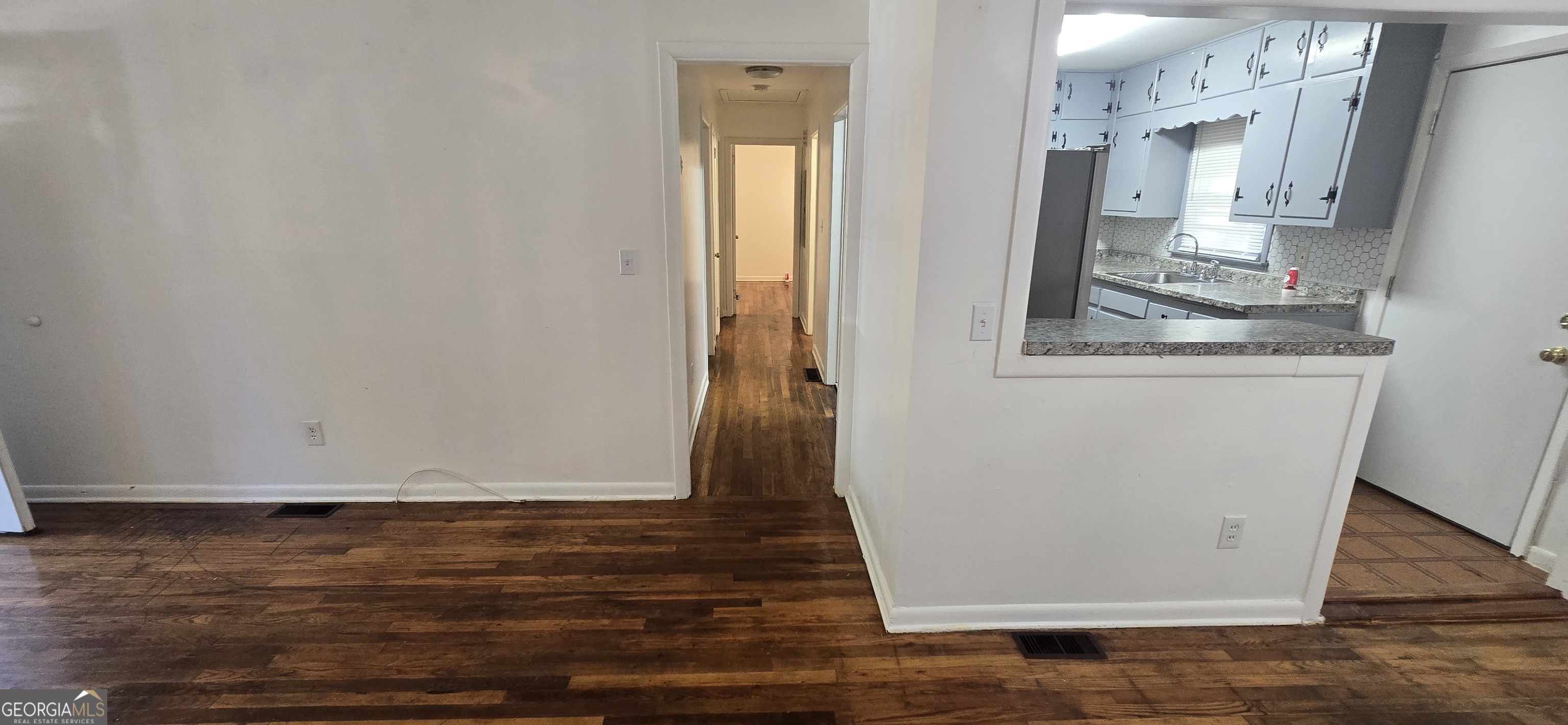 4085 Canby Lane Decatur, GA 30035 - Photo 5 of 12 a view of walk in closet with wooden floor