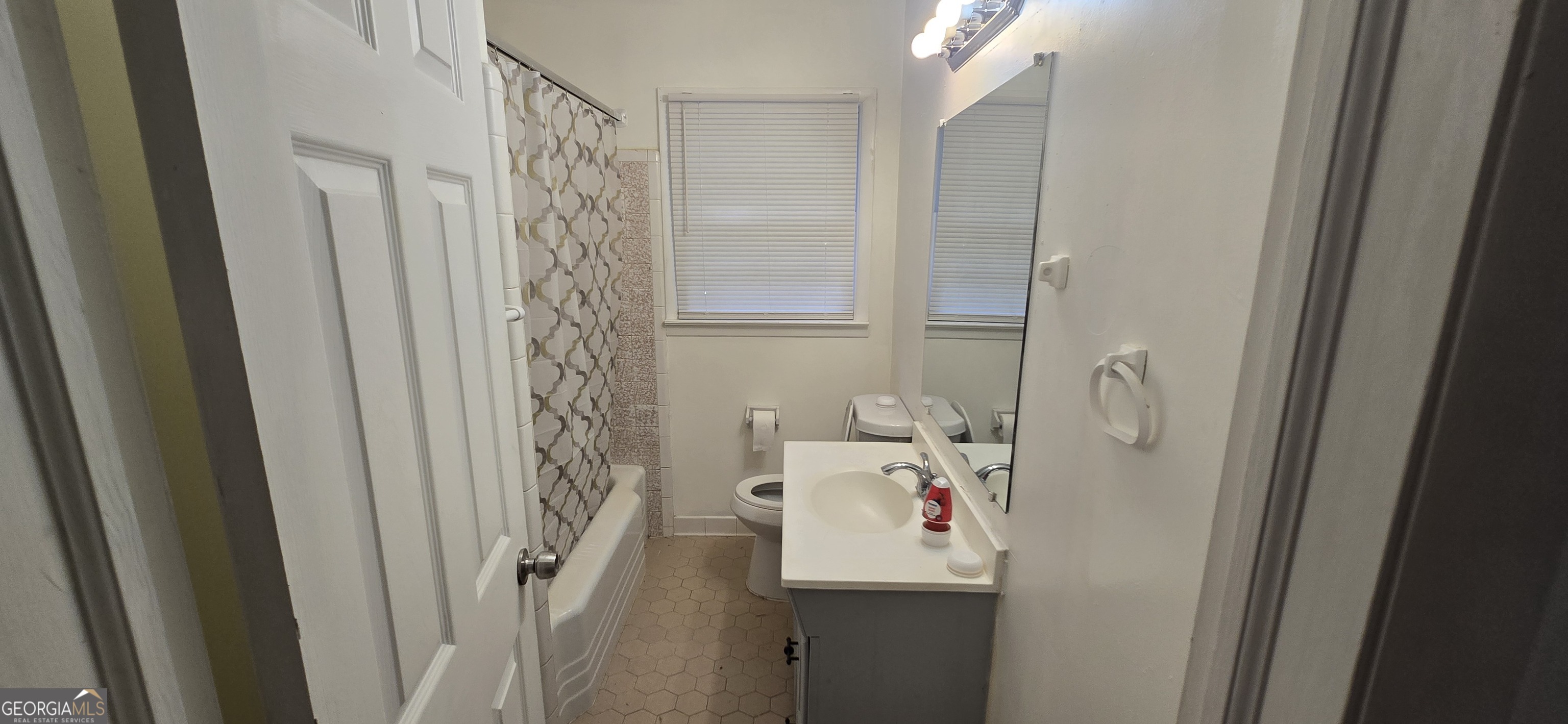 4085 Canby Lane Decatur, GA 30035 - Photo 10 of 12 a room with a window and a bath tub