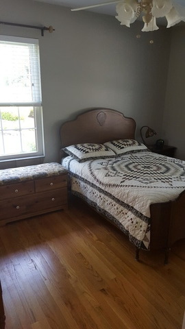 459 Herman Street Crete, IL 60417 - Photo 11 of 20 a bedroom with a bed and wooden floor