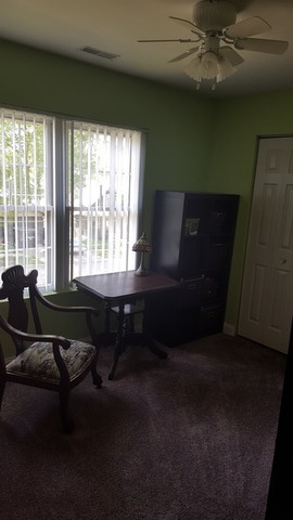 459 Herman Street Crete, IL 60417 - Photo 15 of 20 a living room with furniture and a floor to ceiling window