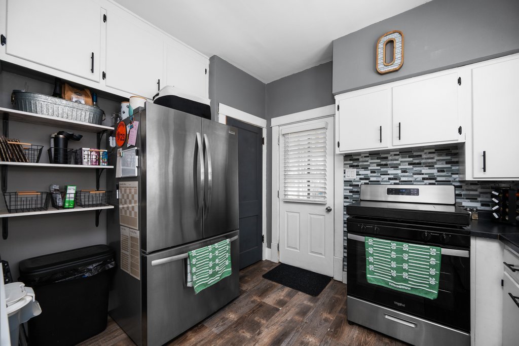 716 Morton Avenue Kewanee, IL 61443 - Photo 11 of 26 a kitchen with stainless steel appliances granite countertop a refrigerator and a stove top oven