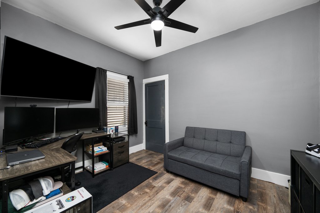 716 Morton Avenue Kewanee, IL 61443 - Photo 12 of 26 a living room with furniture and a flat screen tv