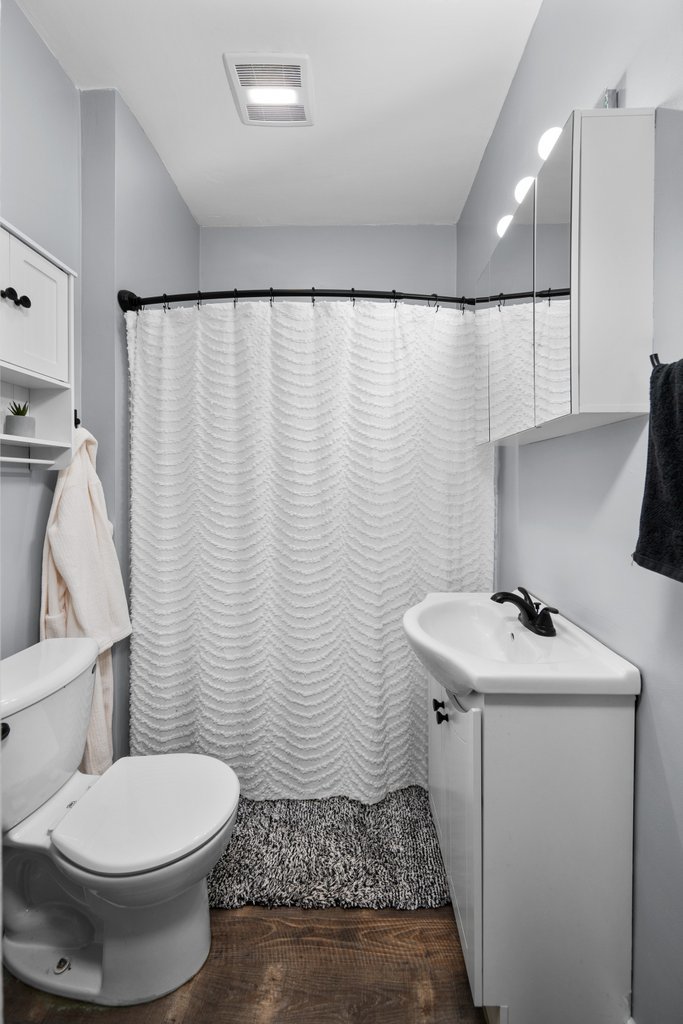 716 Morton Avenue Kewanee, IL 61443 - Photo 15 of 26 a bathroom with a sink toilet and vanity