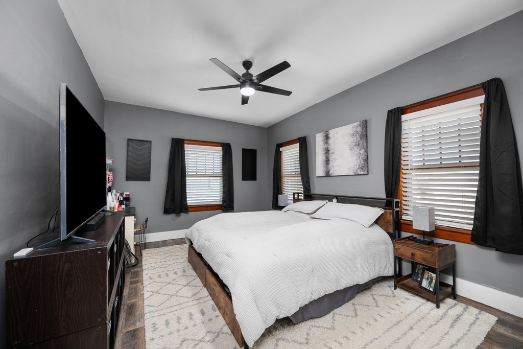 716 Morton Avenue Kewanee, IL 61443 - Photo 17 of 26 a bedroom with a bed and a flat screen tv