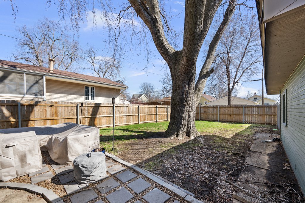 716 Morton Avenue Kewanee, IL 61443 - Photo 21 of 26 a view of a backyard with table and chairs potted plants and large tree