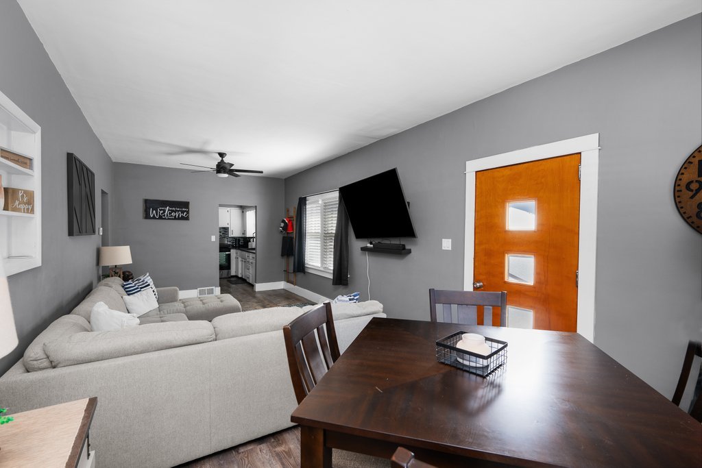 716 Morton Avenue Kewanee, IL 61443 - Photo 4 of 26 a living room with furniture flat screen tv and wooden floor