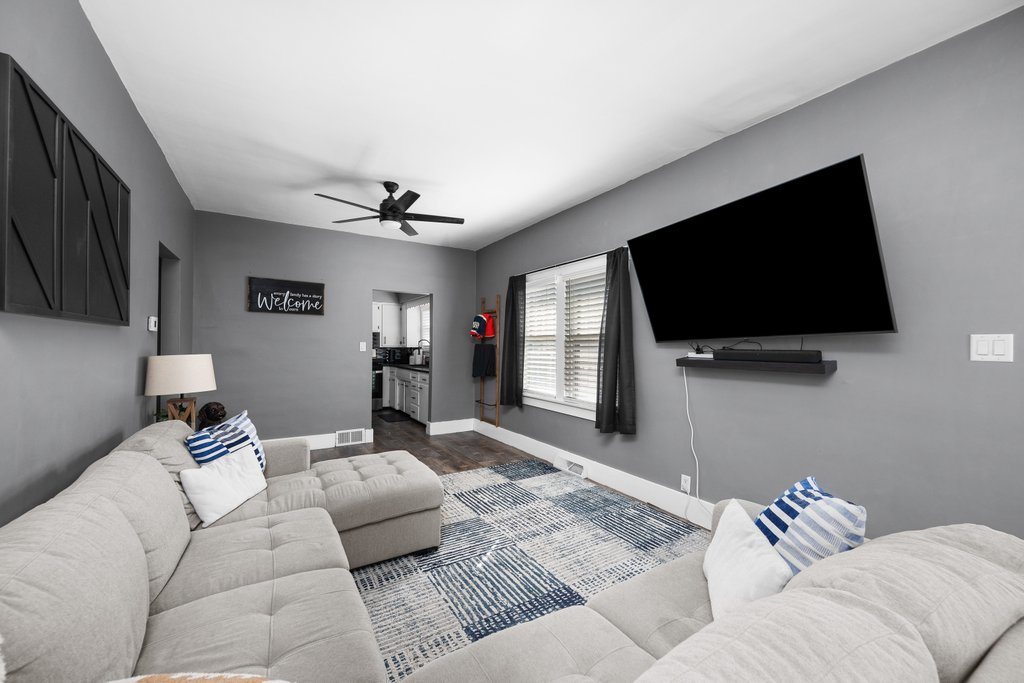 716 Morton Avenue Kewanee, IL 61443 - Photo 7 of 26 a living room with furniture and a flat screen tv