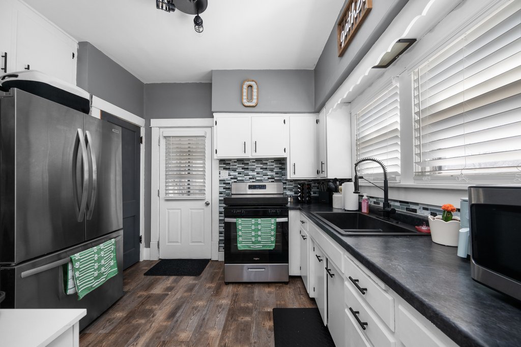 716 Morton Avenue Kewanee, IL 61443 - Photo 8 of 26 a kitchen with stainless steel appliances a stove sink and refrigerator