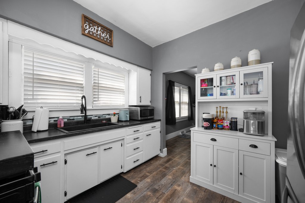 716 Morton Avenue Kewanee, IL 61443 - Photo 9 of 26 a kitchen with cabinets a window and appliances