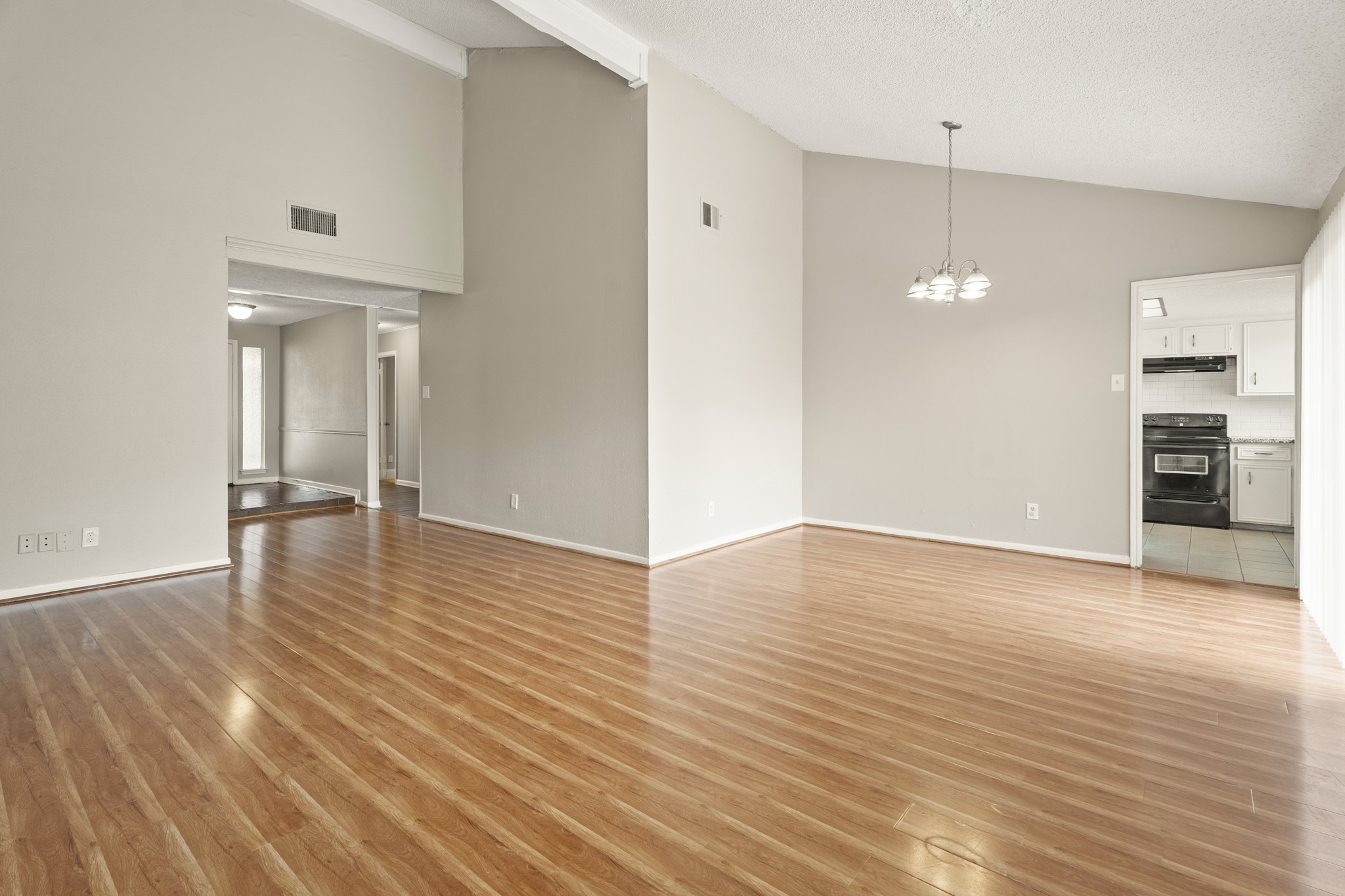 15911 Mill Point Drive Houston, TX 77059 - Photo 5 of 16 wooden floor in an empty room with a window