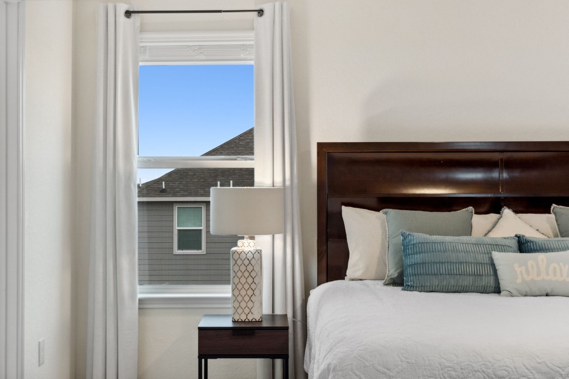 6509 Wagon Spring Street Del Valle, TX 78617 - Photo 18 of 35 Unwind in your luxurious primary bedroom after a long day