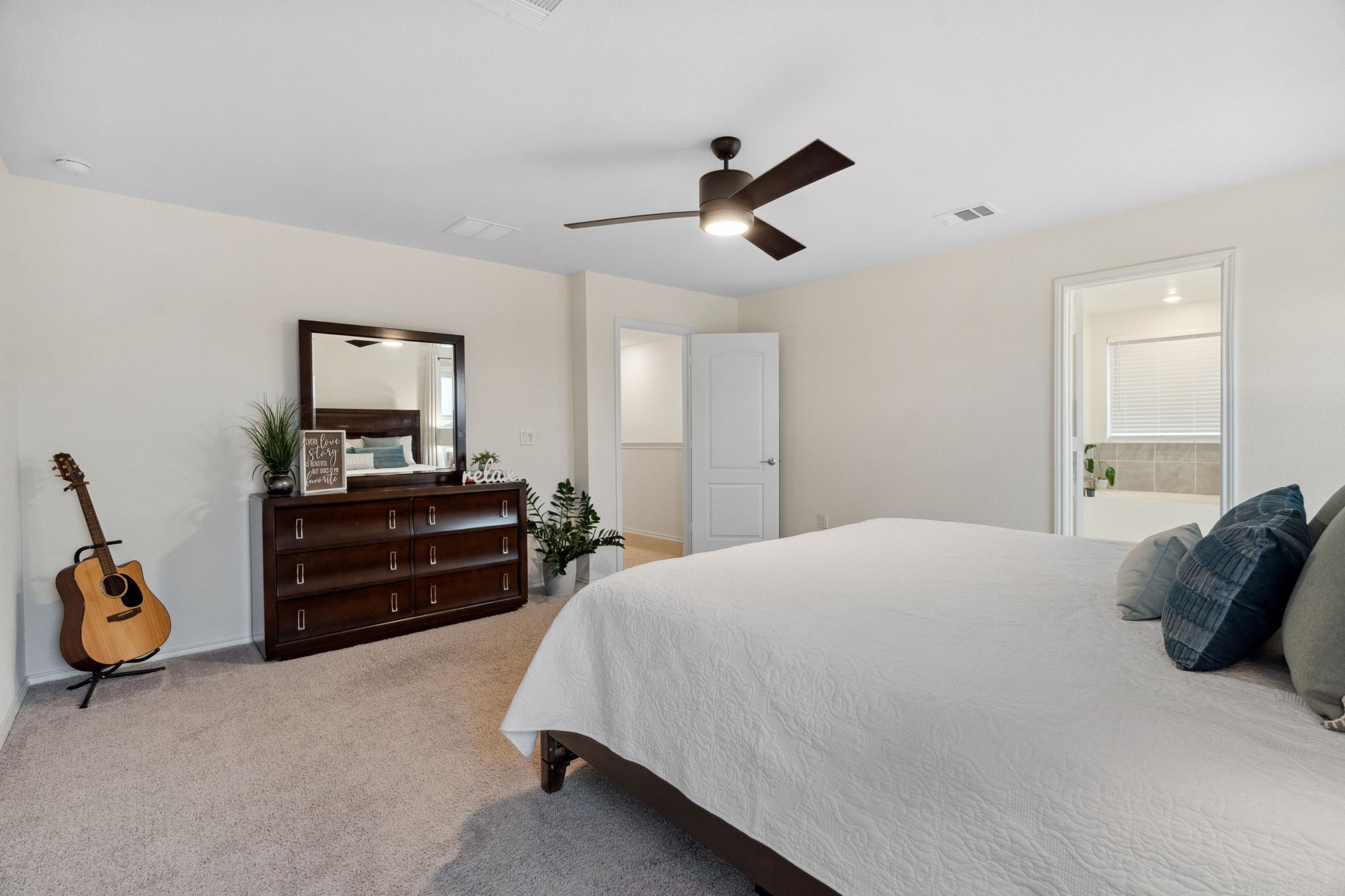 6509 Wagon Spring Street Del Valle, TX 78617 - Photo 19 of 35 The primary bedroom easily accommodates a king-sized bed, with plenty of room to spare