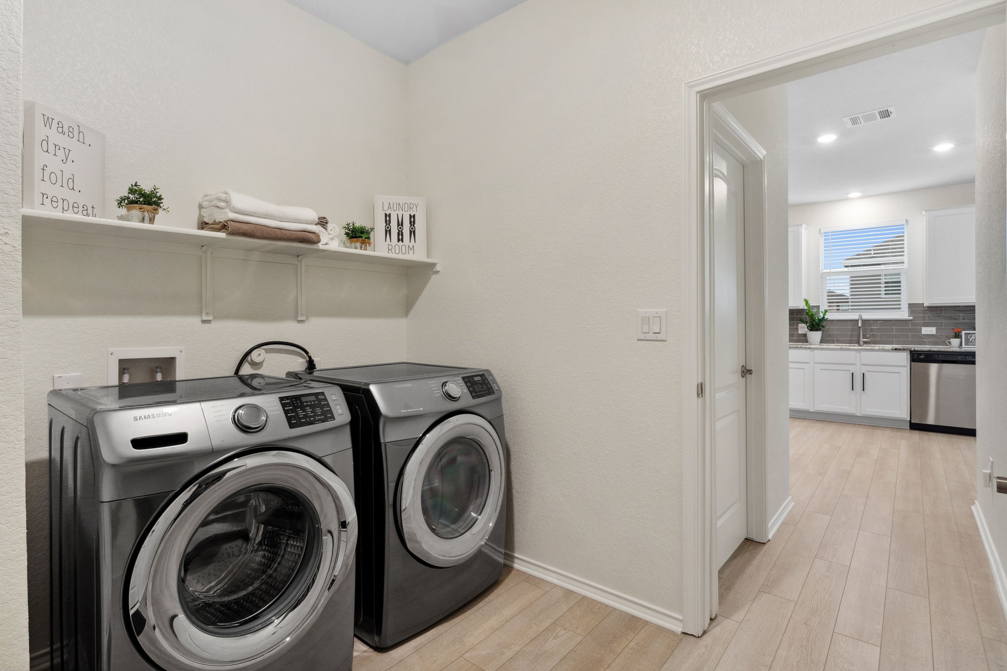 6509 Wagon Spring Street Del Valle, TX 78617 - Photo 27 of 35 Spacious pantry has ample space for laundry area