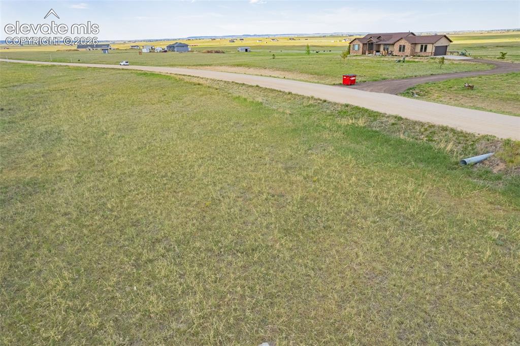 6870 Cowboy Rnch View Peyton, CO 80831 - Photo 15 of 16 a view of an ocean and beach