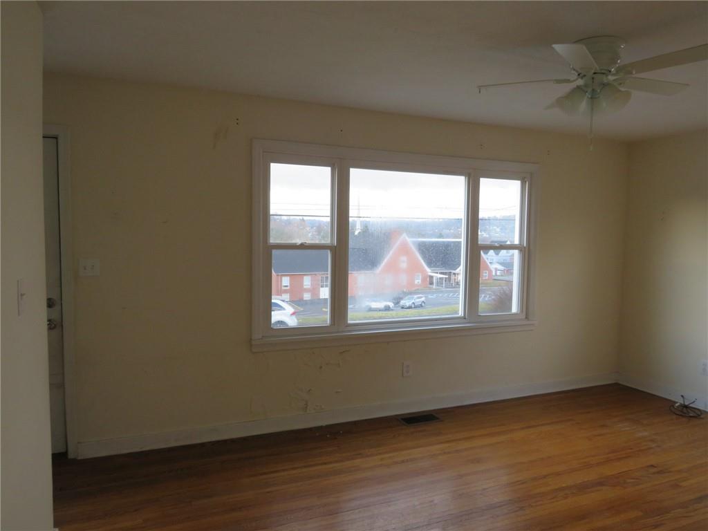 347 Clark Street Washington, PA 15301 - Photo 15 of 33 an empty room with wooden floor and windows