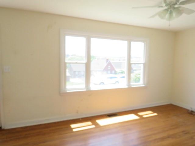 347 Clark Street Washington, PA 15301 - Photo 3 of 33 an empty room with wooden floor and windows