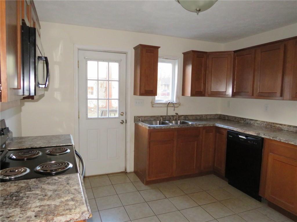 347 Clark Street Washington, PA 15301 - Photo 7 of 33 a kitchen with a cabinets and a stove top oven