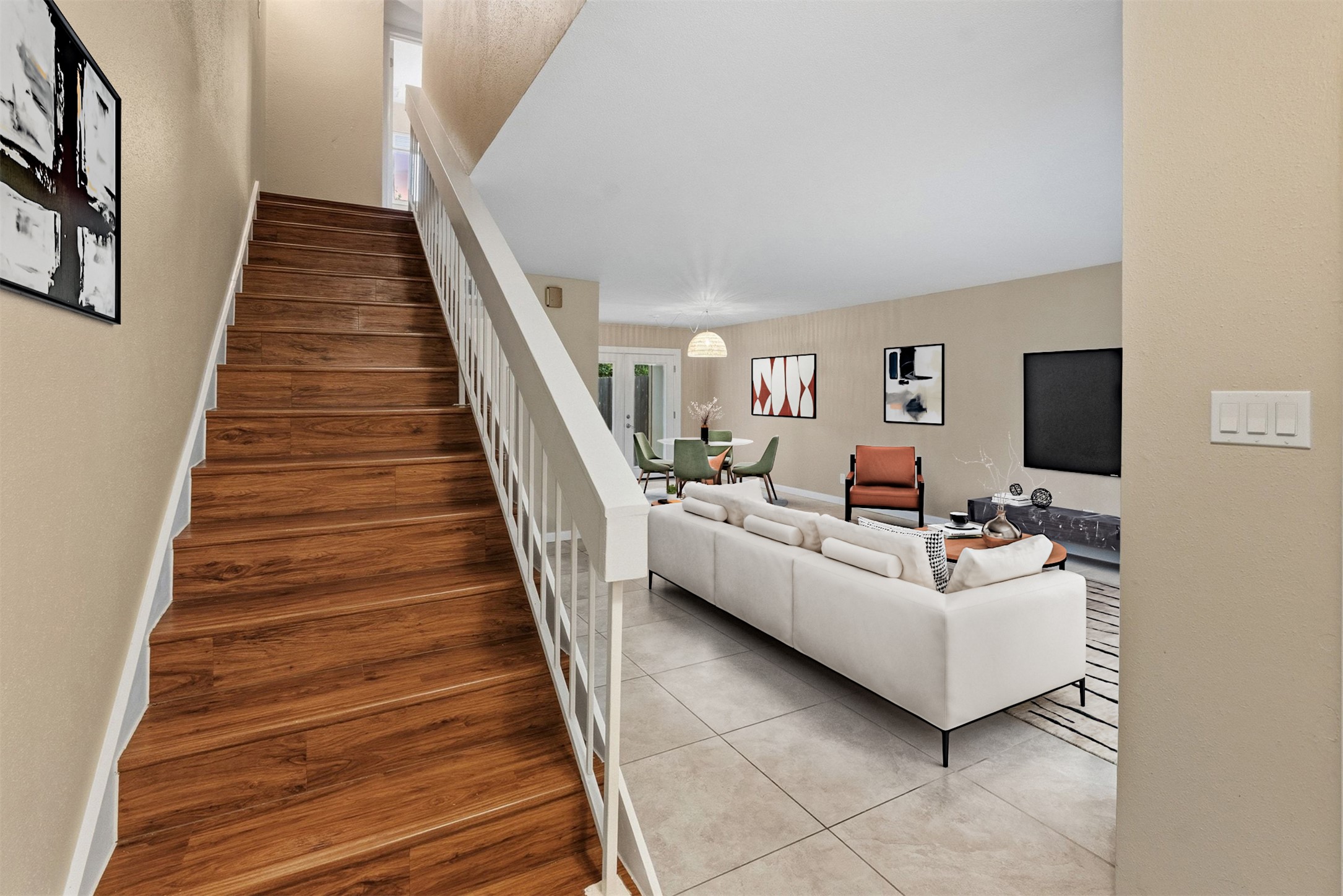 702 Castle Ridge Road, Unit C Austin, TX 78746 - Photo 29 of 36 This updated two-story residence offers approximately 1,144 square feet with 2 bedrooms, 1.5 bathrooms, and an open floor plan filled with natural light. Features include vinyl and tile flooring throughout with no carpet, granite countertops, and a walk-in shower. The main level features a comfortable living area that flows into the dining space and kitchen, creating an ideal setting for daily living and entertaining.