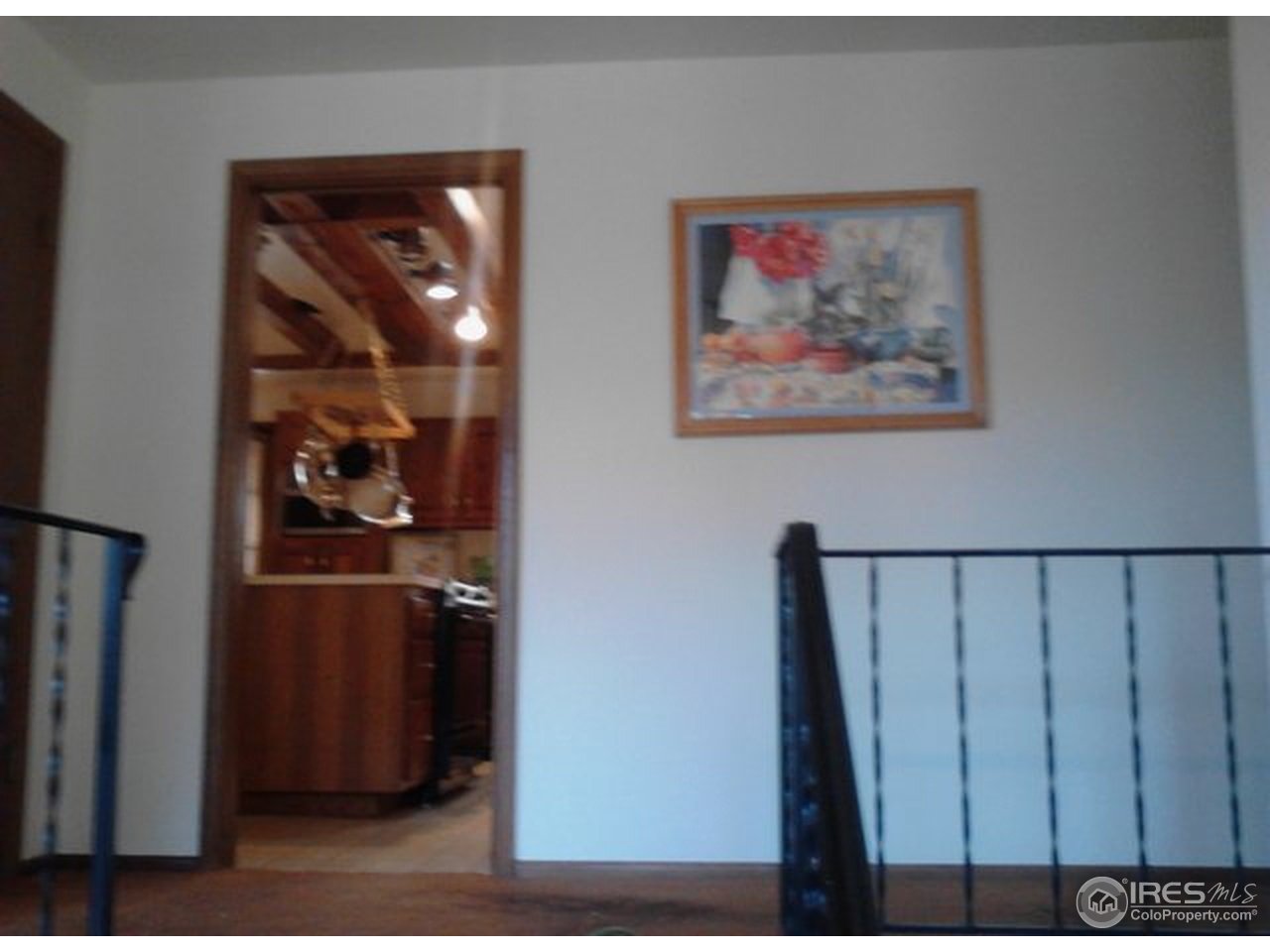 6518 Olde Stage Road Boulder, CO 80302 - Photo 4 of 23 a view of a hallway with wooden floor and cabinet