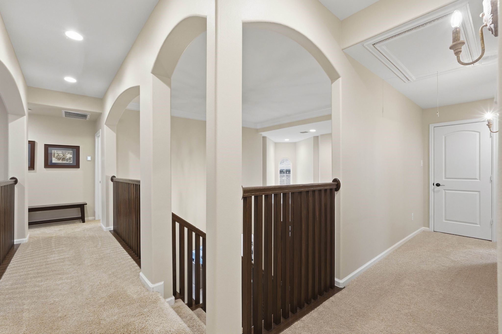 147 West Valera Ridge Place The Woodlands, TX 77389 - Photo 29 of 50 Lighted hallway on the opposite side of the game room accented by beautiful wall sconces.