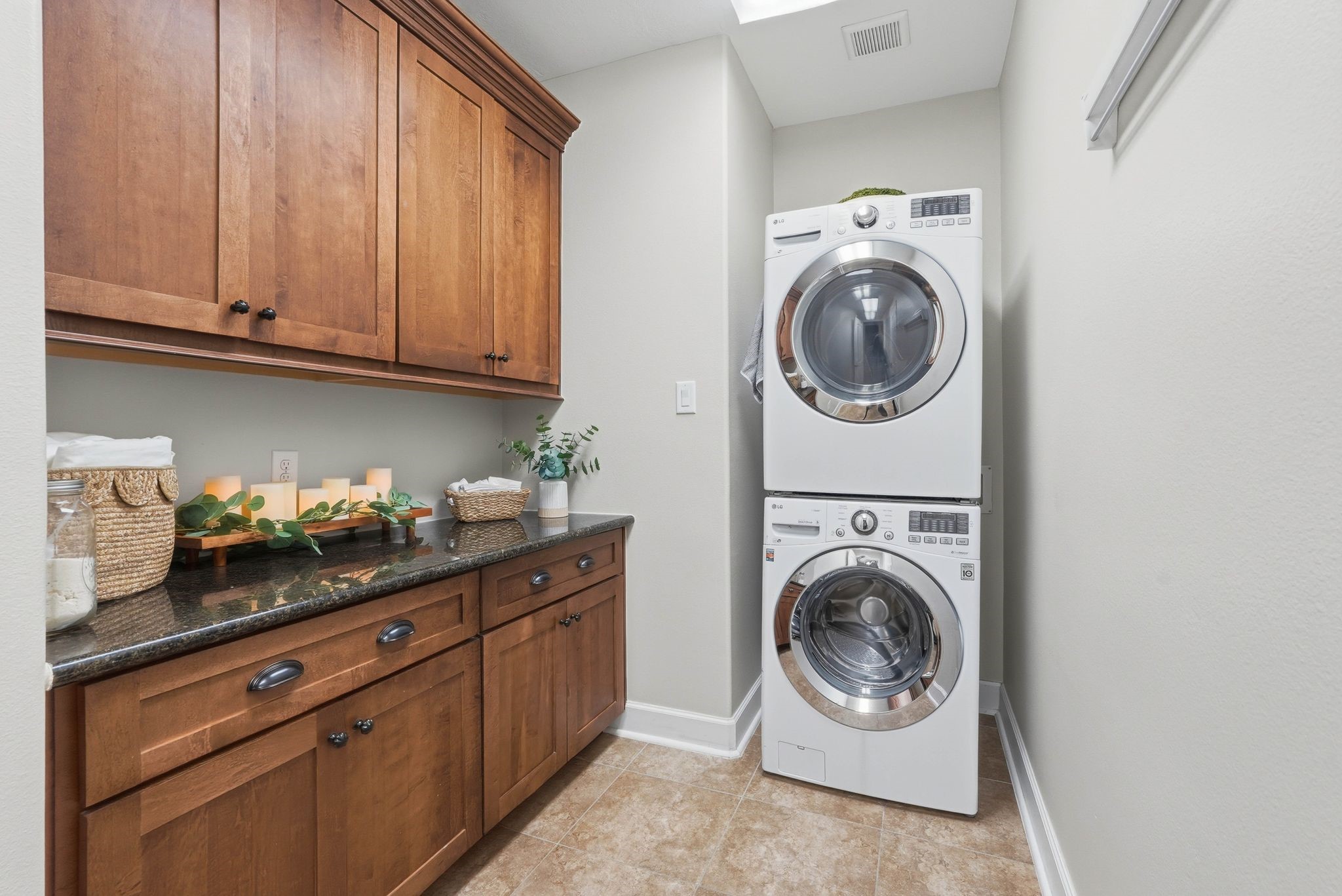 147 West Valera Ridge Place The Woodlands, TX 77389 - Photo 36 of 50 HUGE utility room with beautiful cabinets and granite countertops.