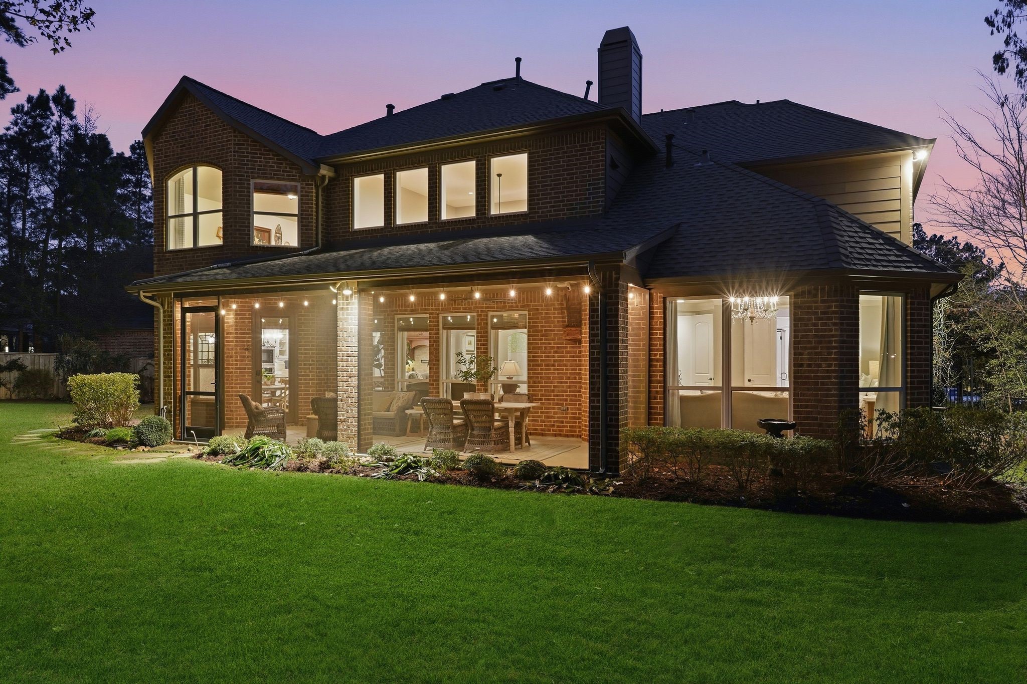 147 West Valera Ridge Place The Woodlands, TX 77389 - Photo 50 of 50 Serene evening shot highlighting the home’s elegant exterior and peaceful outdoor atmosphere.What are you waiting for? This home is a DREAM!