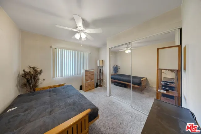 a living room with furniture a window and a chandelier