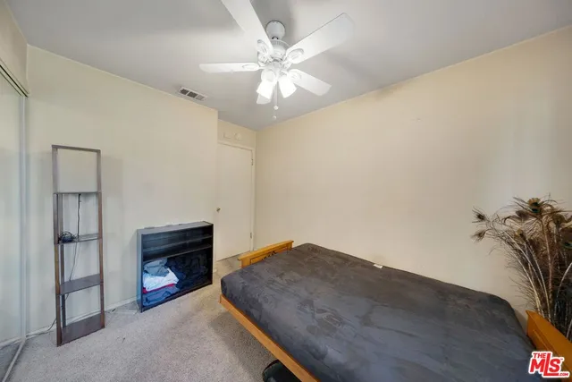 wooden floor with a fireplace in room
