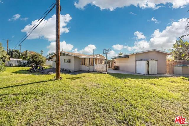 a house view with a backyard space