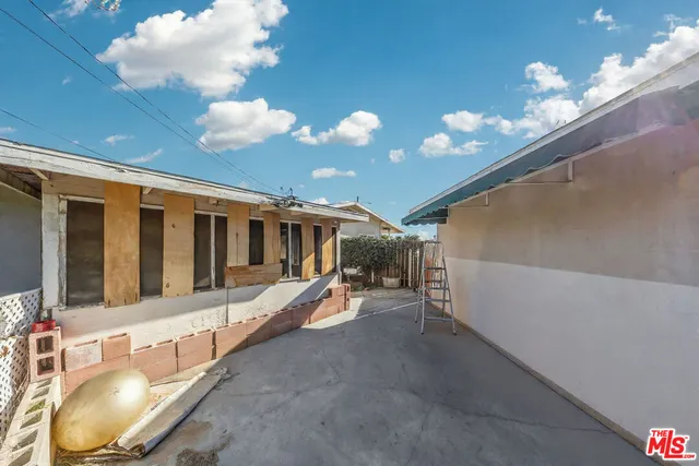 a lobby with furniture and chandelier