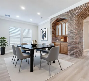 a view of a dining room with furniture and window