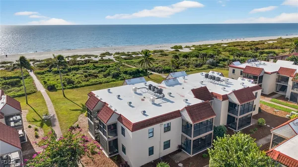 an aerial view of a house with a big yard