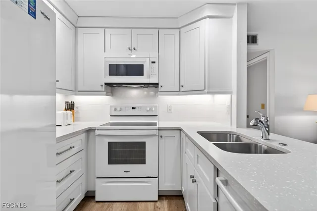 a spacious bedroom with a bed and a large window