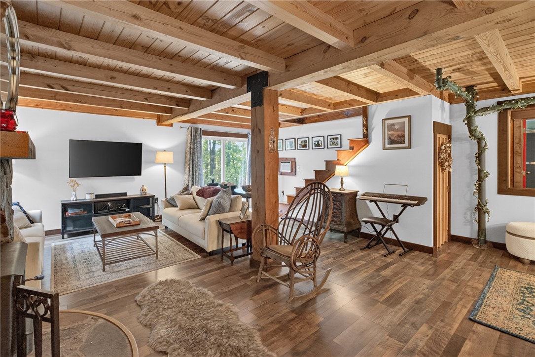 130 Maggie Rufus Lane Westminster, SC 29693 - Photo 14 of 50 Exposed wood beams add rustic character to this welcoming, open-plan living space.