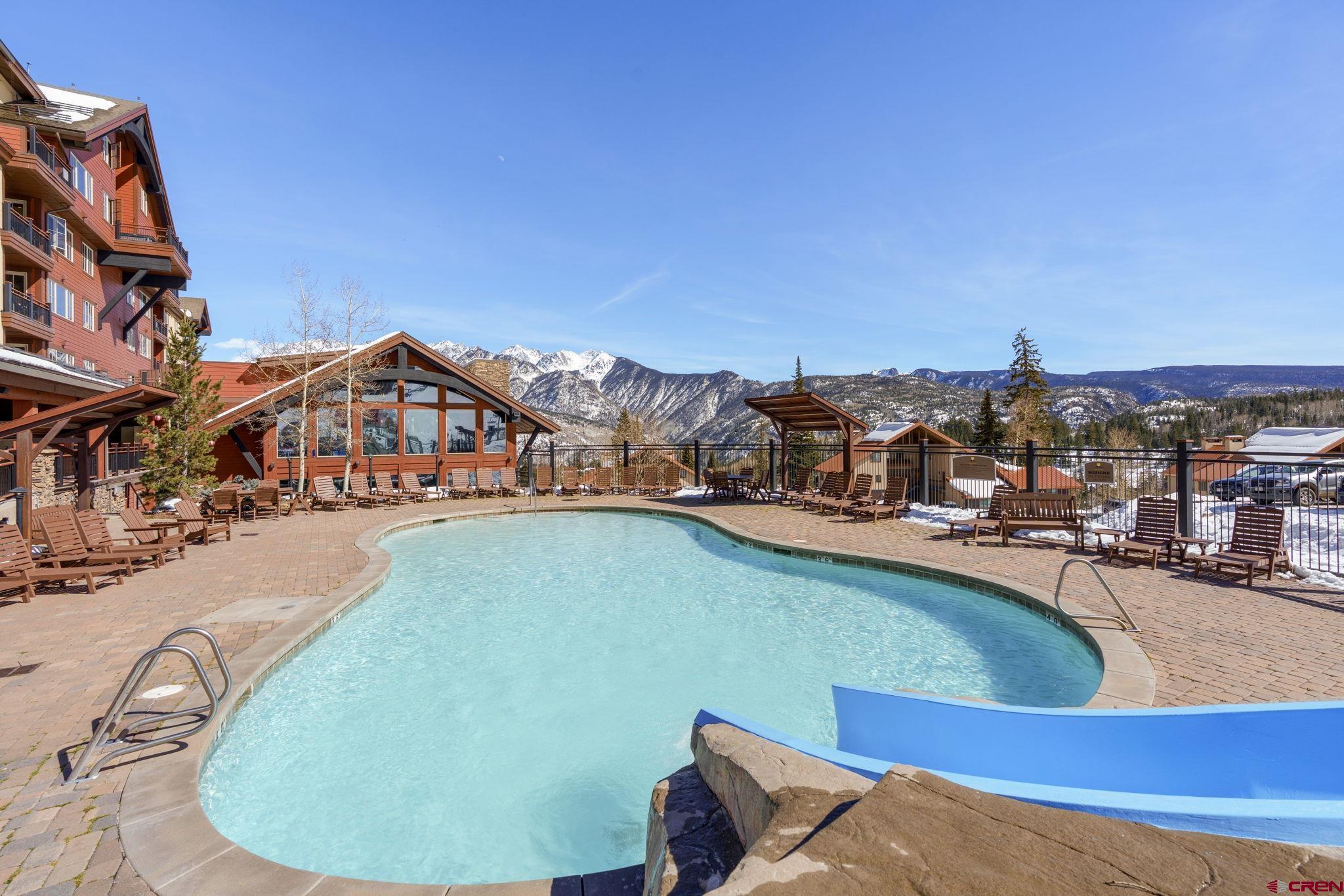71 Needles Way, Unit 440 Durango, CO 81301 - Photo 17 of 31 a view of a swimming pool with a lounge chairs