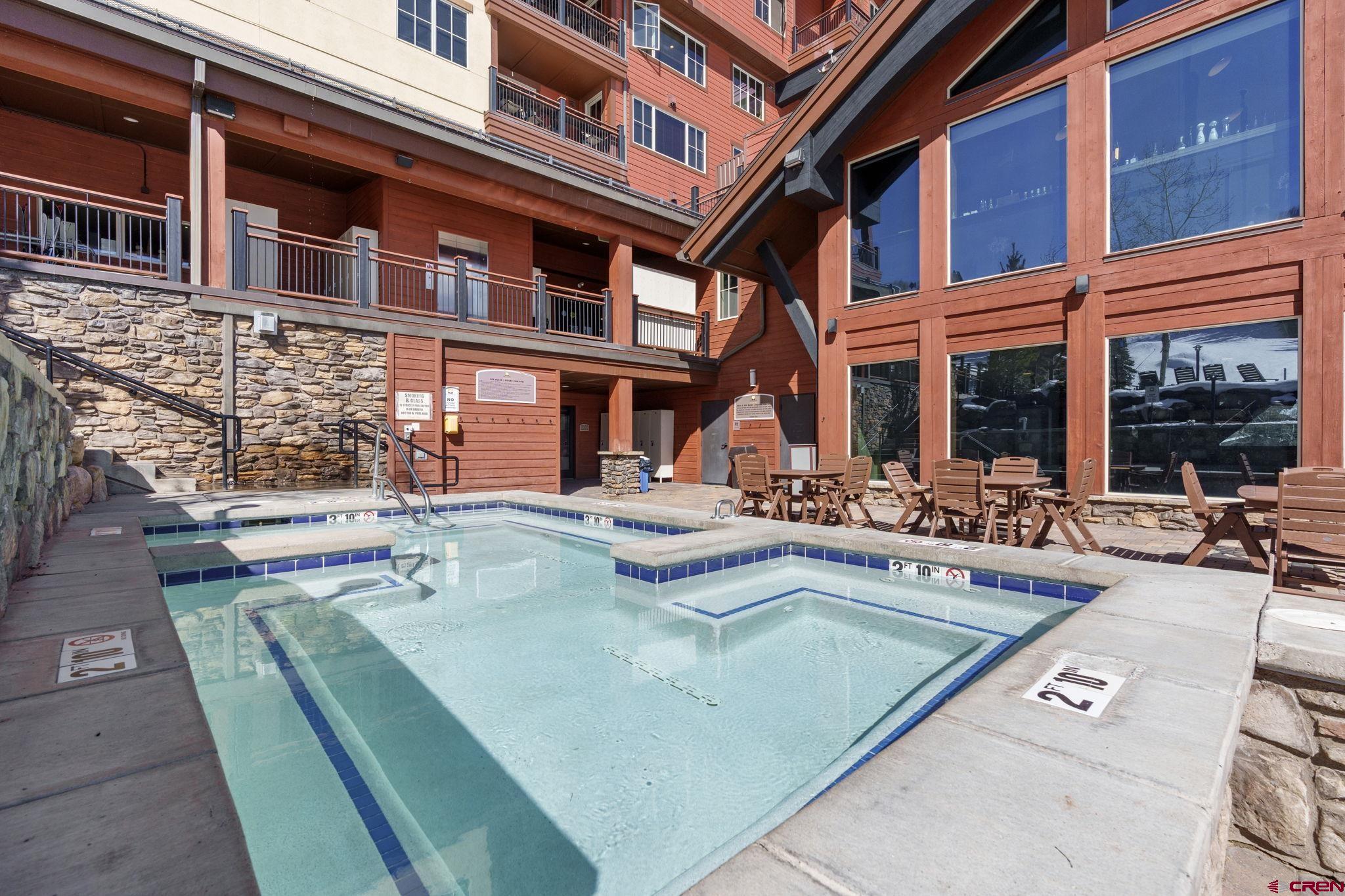 71 Needles Way, Unit 440 Durango, CO 81301 - Photo 19 of 31 a view of a house with swimming pool and sitting area