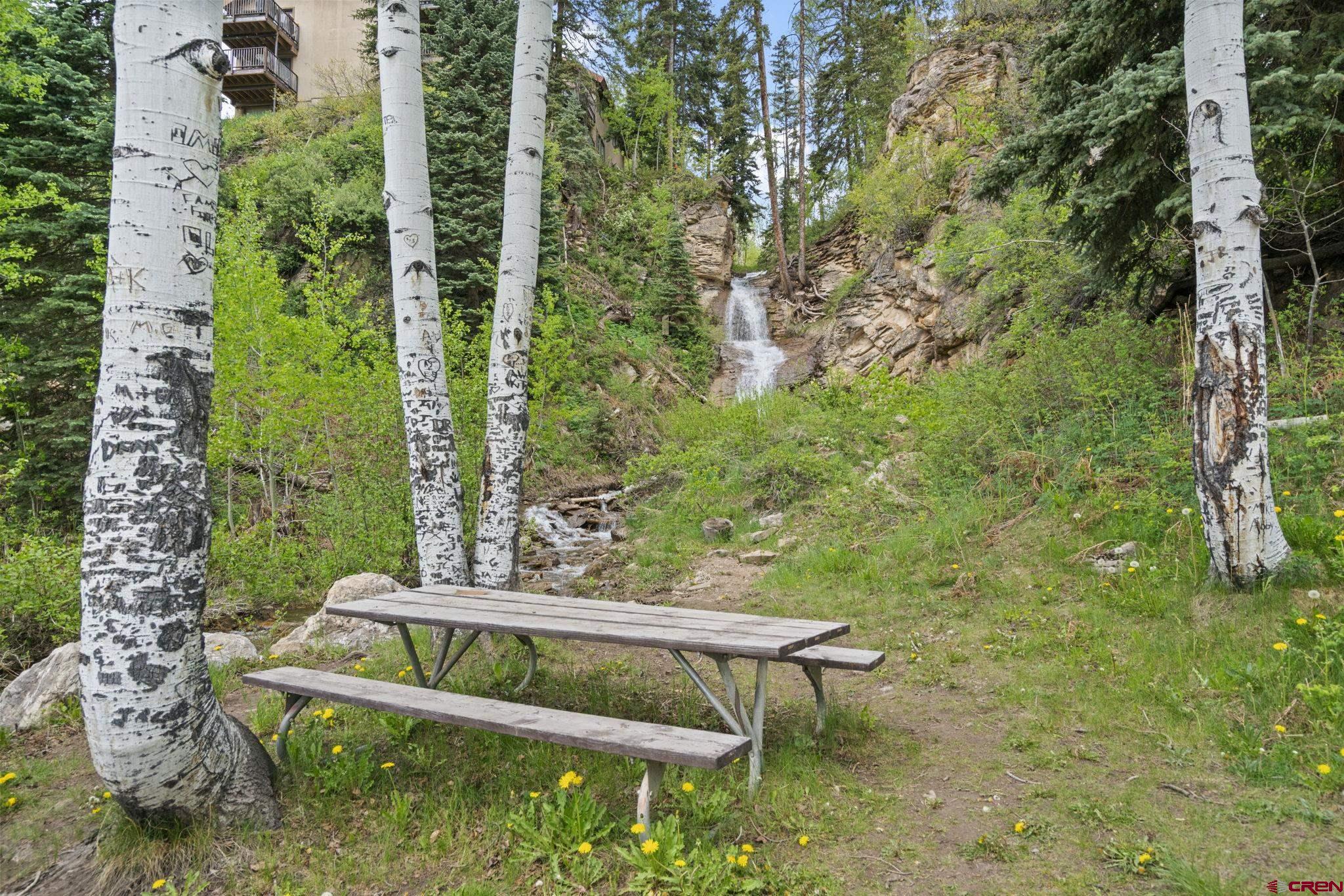 71 Needles Way, Unit 440 Durango, CO 81301 - Photo 27 of 31 a view of a yard with a bench