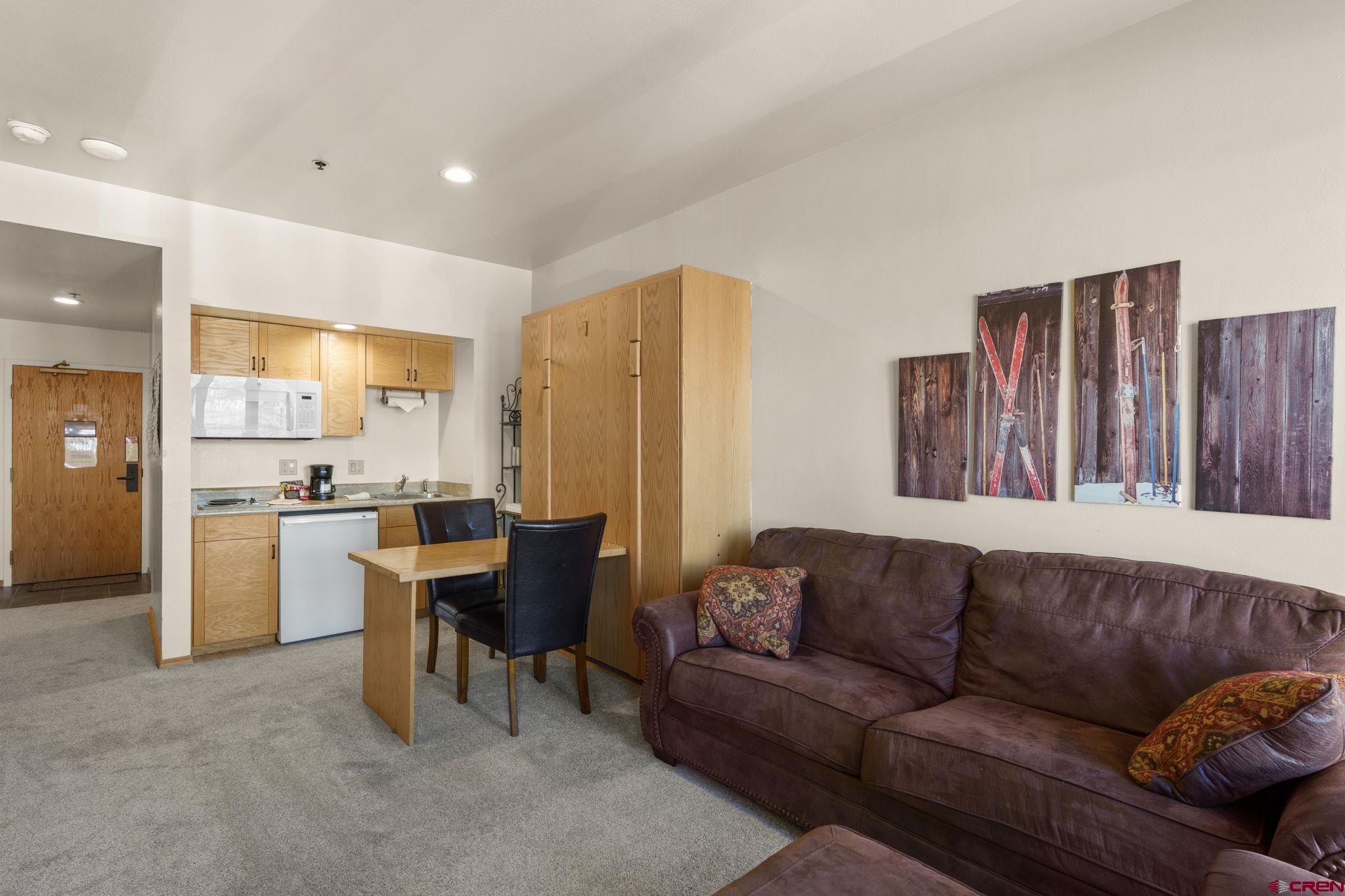 71 Needles Way, Unit 440 Durango, CO 81301 - Photo 8 of 31 a living room with furniture and a large window